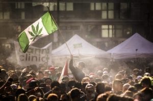 People smoke marijuana during a 4/20 cannabis culture rally in Toronto.